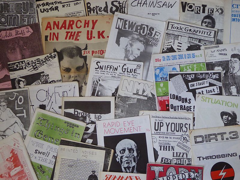 A collection of underground music fanzines from the 1970s, featuring hand-drawn typography and black-and-white print collages